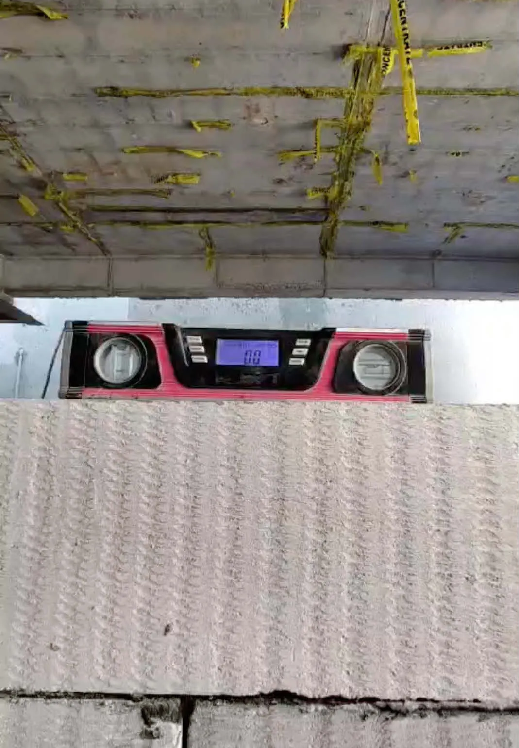 Laser level check on a wall